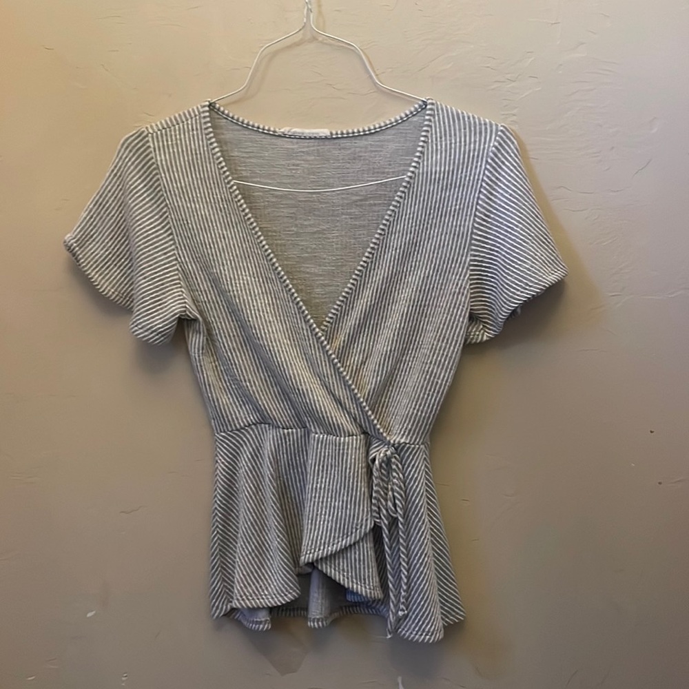 Caution to the wind wrap around top! Size Medium